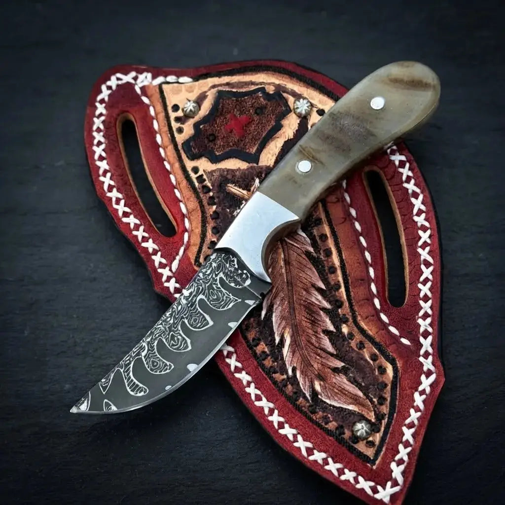 Small 1095 carbon skinner knife and hand-stitched leather sheath, ram horn grip