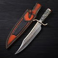 12-inch Musso-style Copper Damascus Bowie knife featuring a brass spine strip, curved double guard, and black-and-white pattern resin handle, displayed next to its custom brown and black leather sheath on a dark wood background