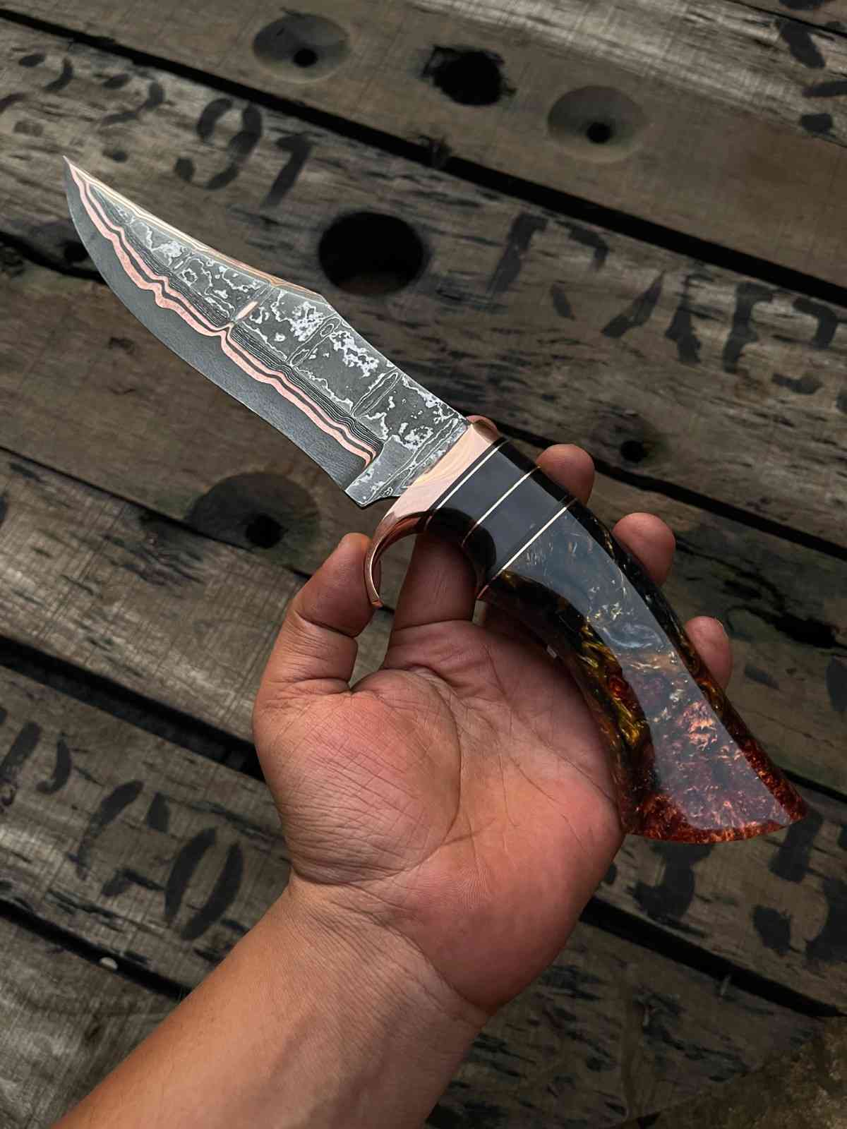 Hand-Forged Copper Damascus Bowie Knife with Custom Resin Handle
Fixed Blade Knife with Leather Sheath