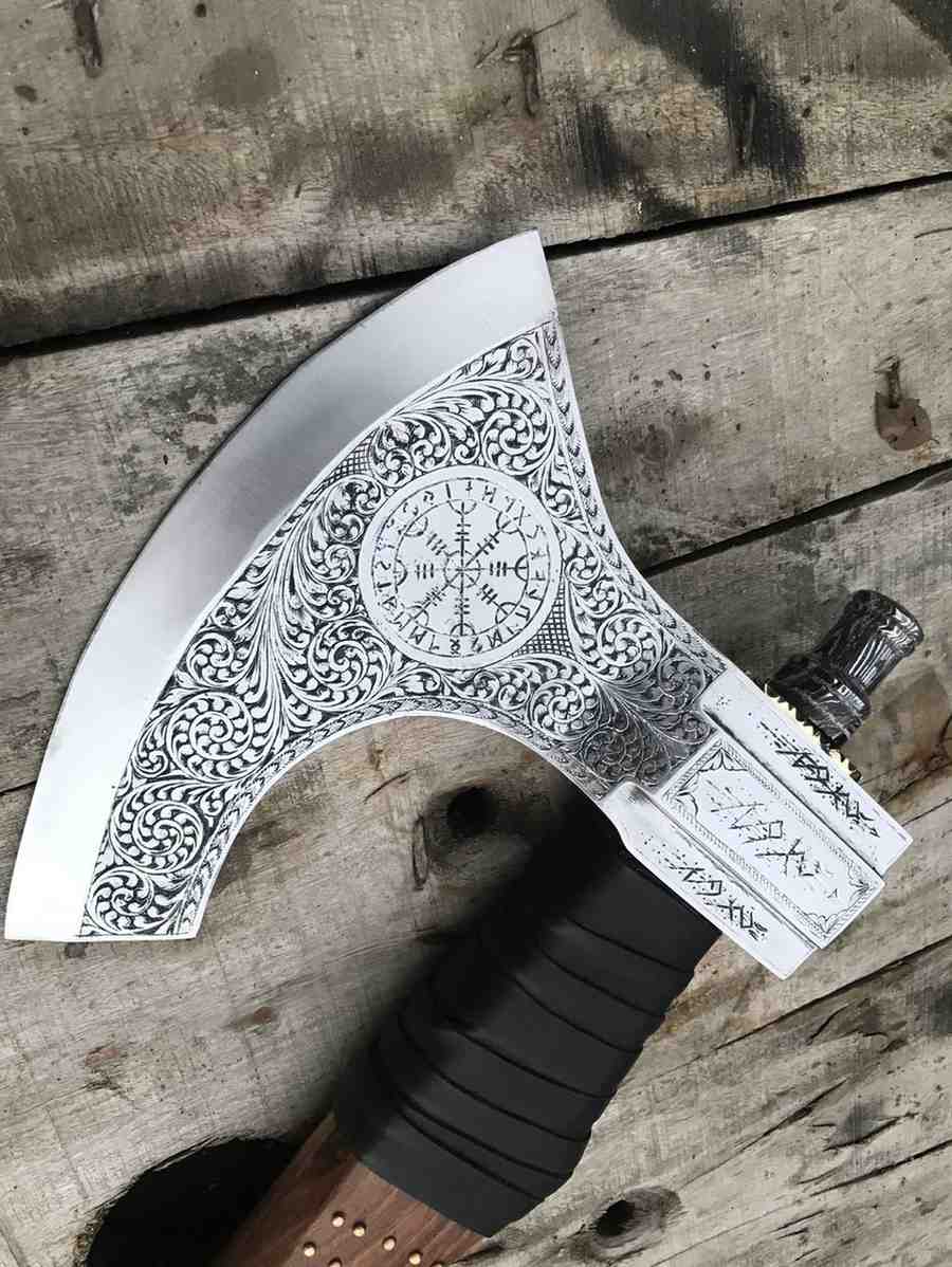 Close-up of a premium leather-wrapped wooden handle with brass stud details on a handcrafted Viking axe