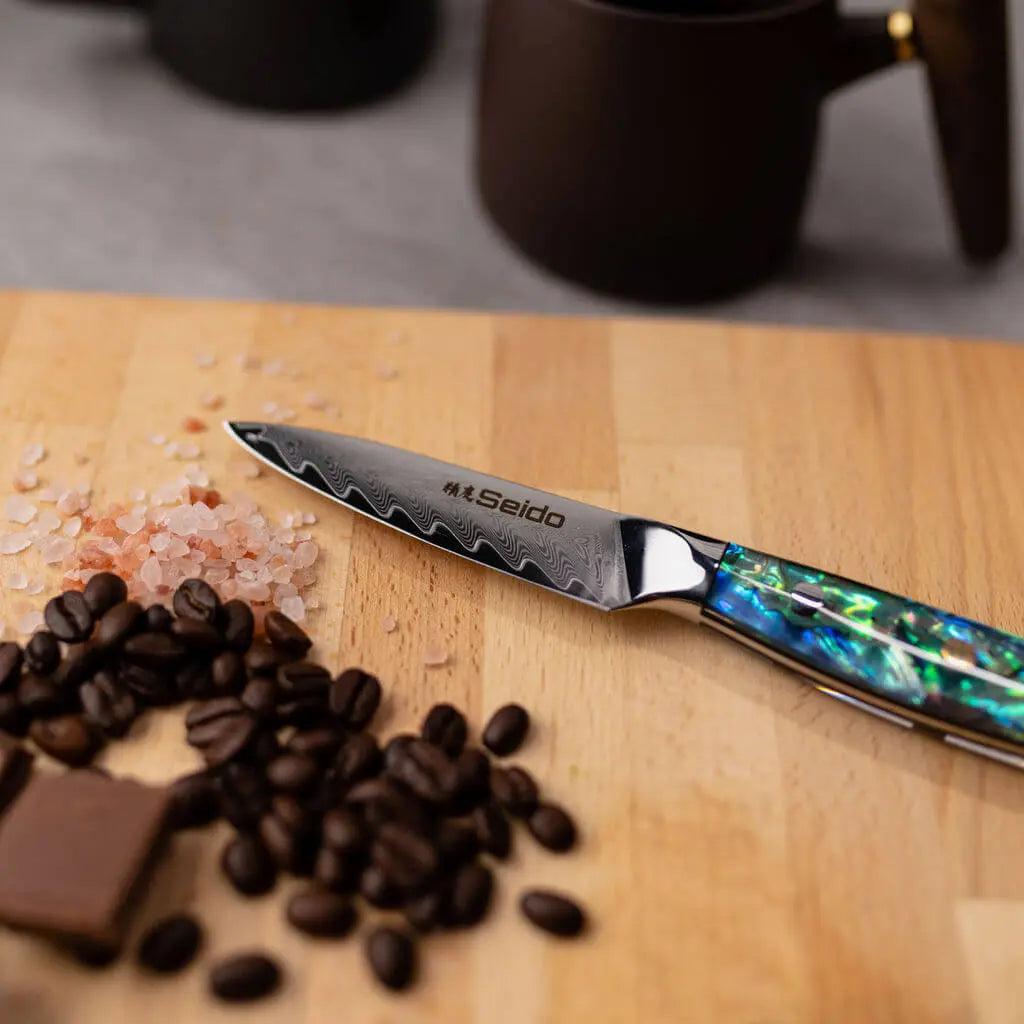 Full-tang Awabi Japanese Damascus chef knife with abalone resin handle