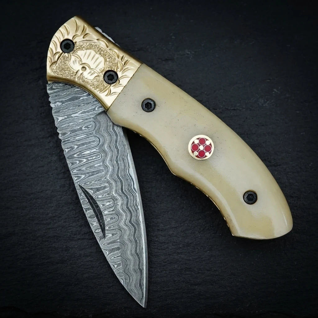 Hand forged Damascus drop point folding knife with camel bone handle