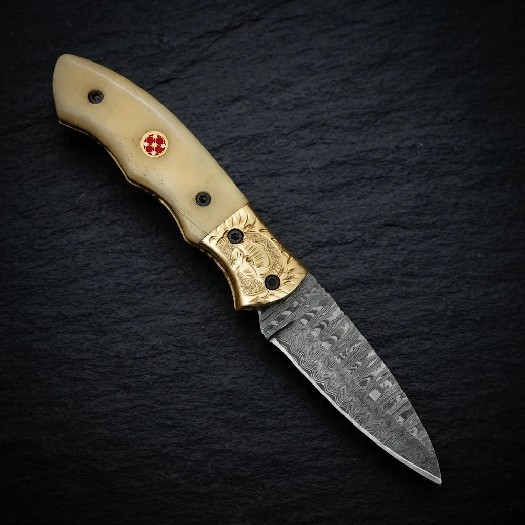 Damascus drop point folding knife — 156-layer blade pattern detail