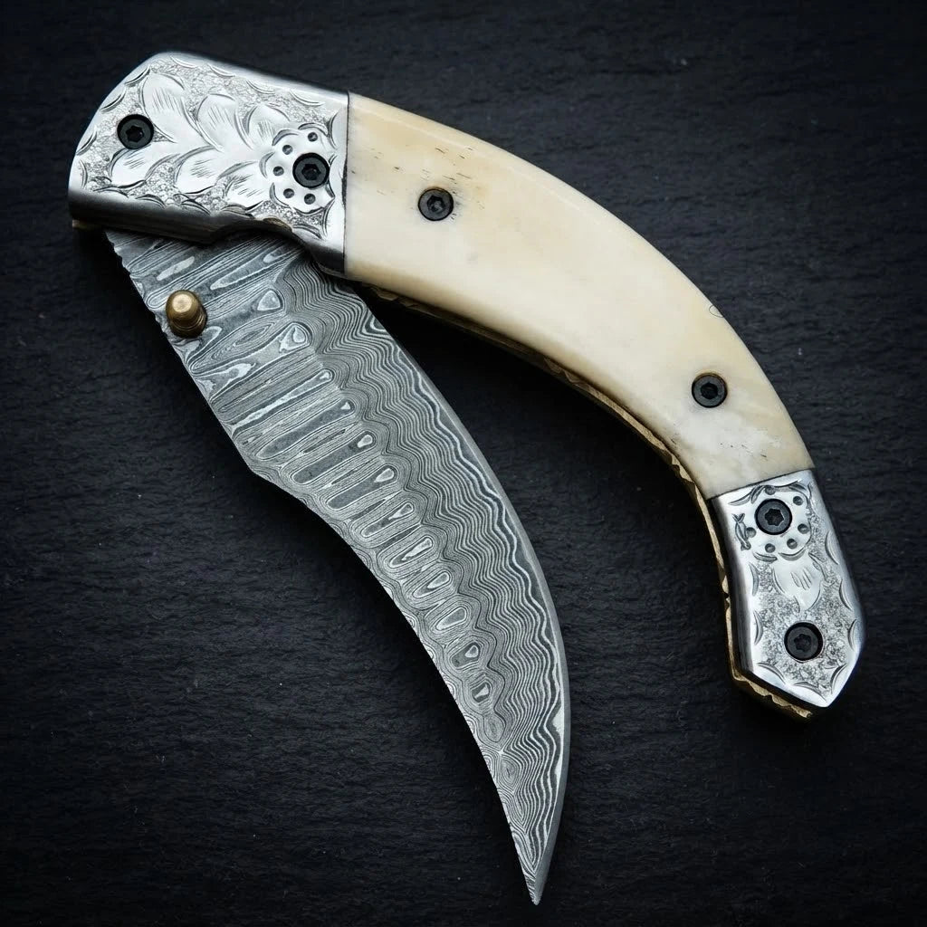 Damascus folding knife — 156-layer blade pattern detail