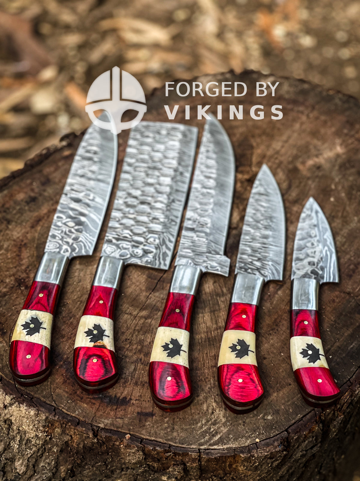 Hand-forged Damascus steel blade pattern on Canadian maple leaf kitchen knife set