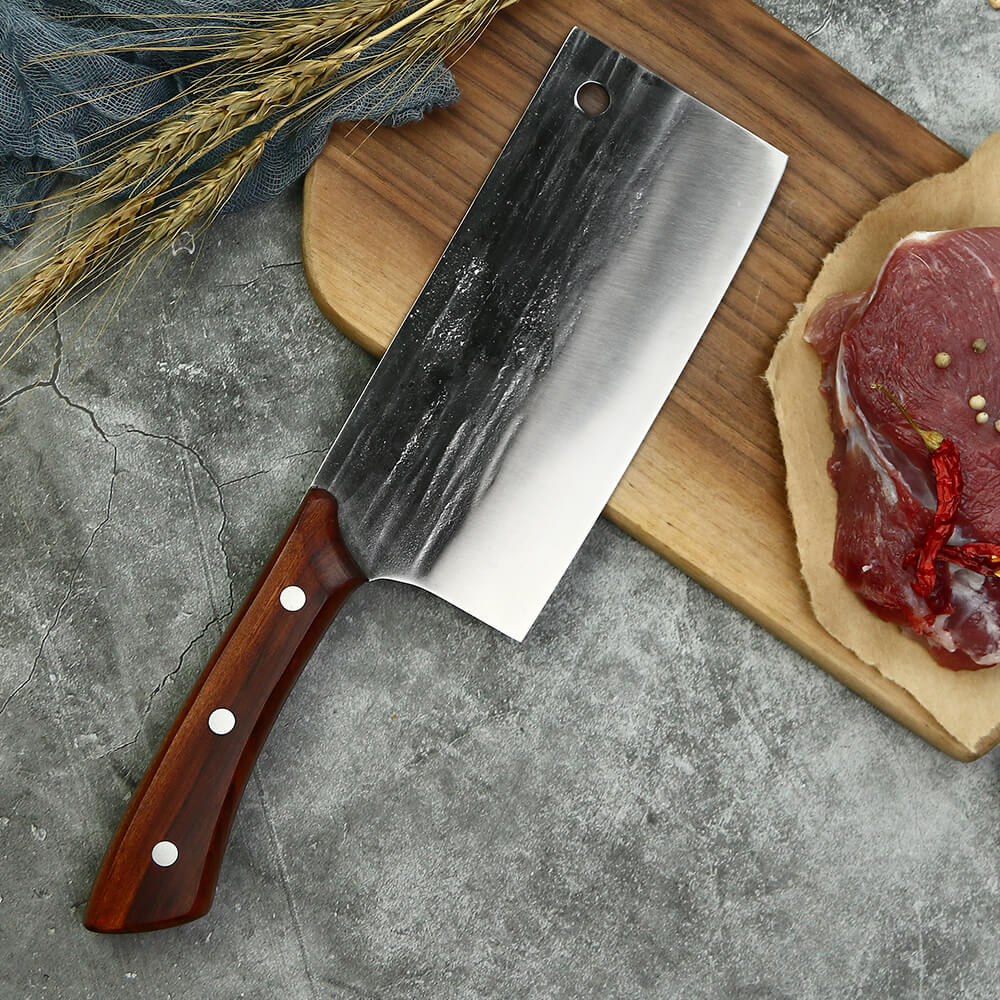 Mahogany handle detail on the Caveman high-carbon steel butcher knife set