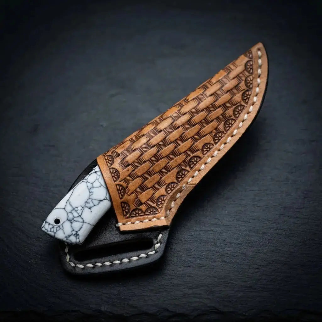 Compact cowboy skinner knife with hand-stitched cross-draw leather sheath