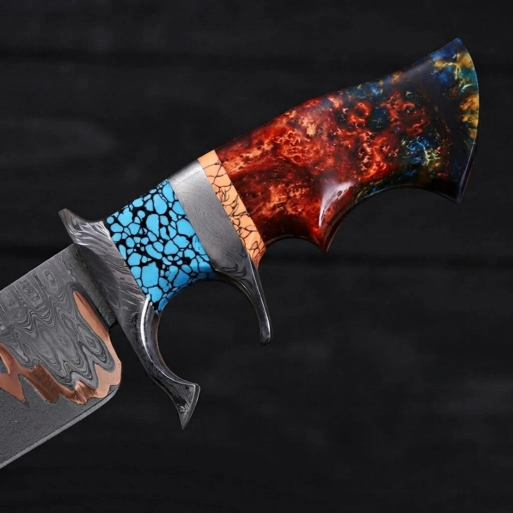 Close-up of a Bowie knife handle showing a steel double guard, turquoise stone mosaic accent, and multi-colored fire resin grip on a black background.