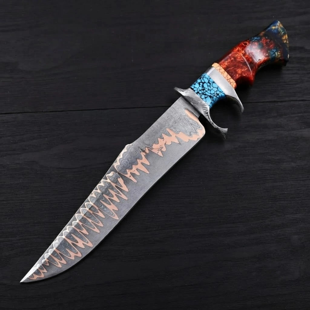 A diagonal view of a custom Copper Damascus Bowie knife showcasing its layered wave blade pattern, steel double guard, turquoise mosaic segment, and multi-colored resin handle on a dark wood background