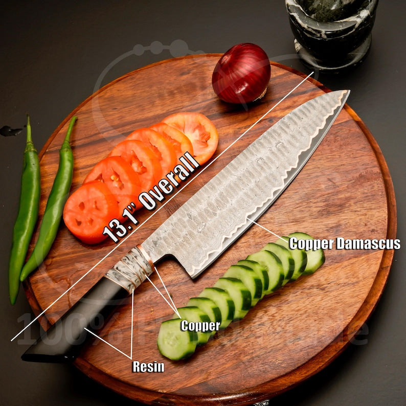 Five copper Damascus steel blades arranged over a leather cover