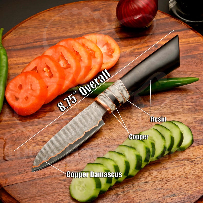 Copper Damascus chef knife set with handles shown alongside the blades