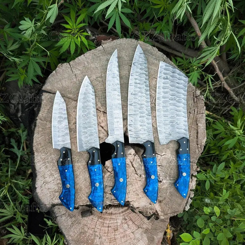 Damascus chef knife set laid out showing all pieces