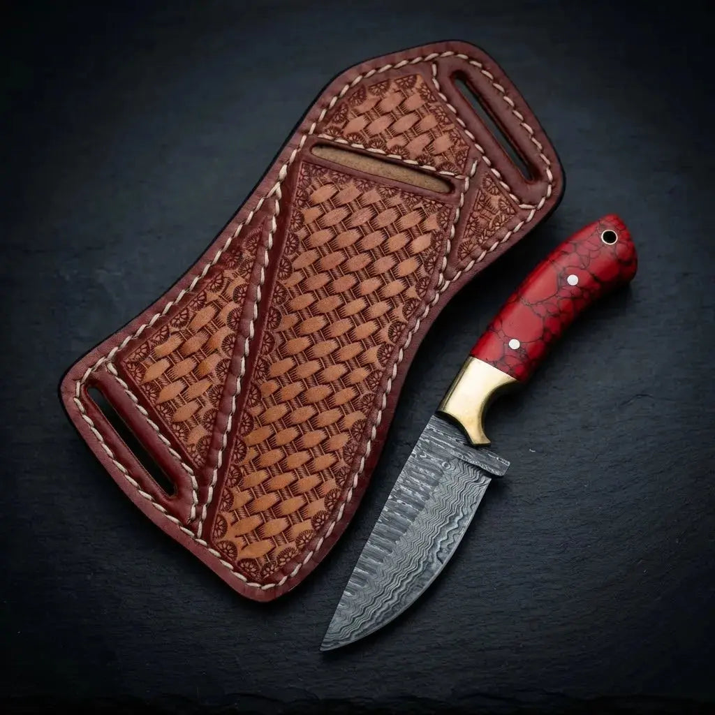 Damascus steel cowboy knife with red stone-style handle and solid brass bolster
