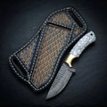 Damascus cowboy knife with stone handle, brass bolster and leather pancake sheath
