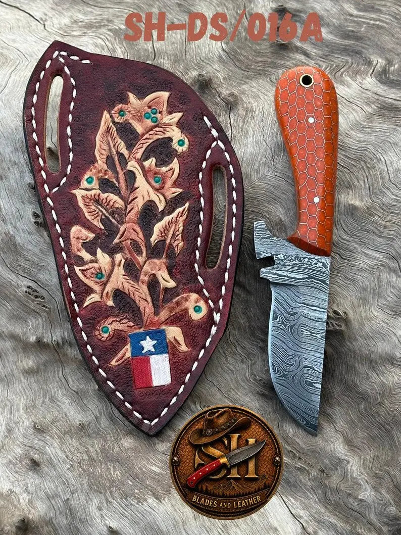 Layered Damascus pattern on the 3 inch high-carbon blade of a cowboy skinner knife
