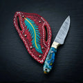 Damascus cowboy skinner knife with resin handle and brass bolster