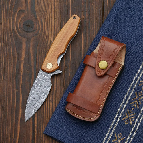 Handmade Damascus pocket knife with ball bearing fast-open and olive wood handle – handle detail