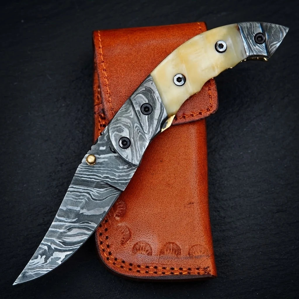 Damascus steel folding knife with camel bone handle