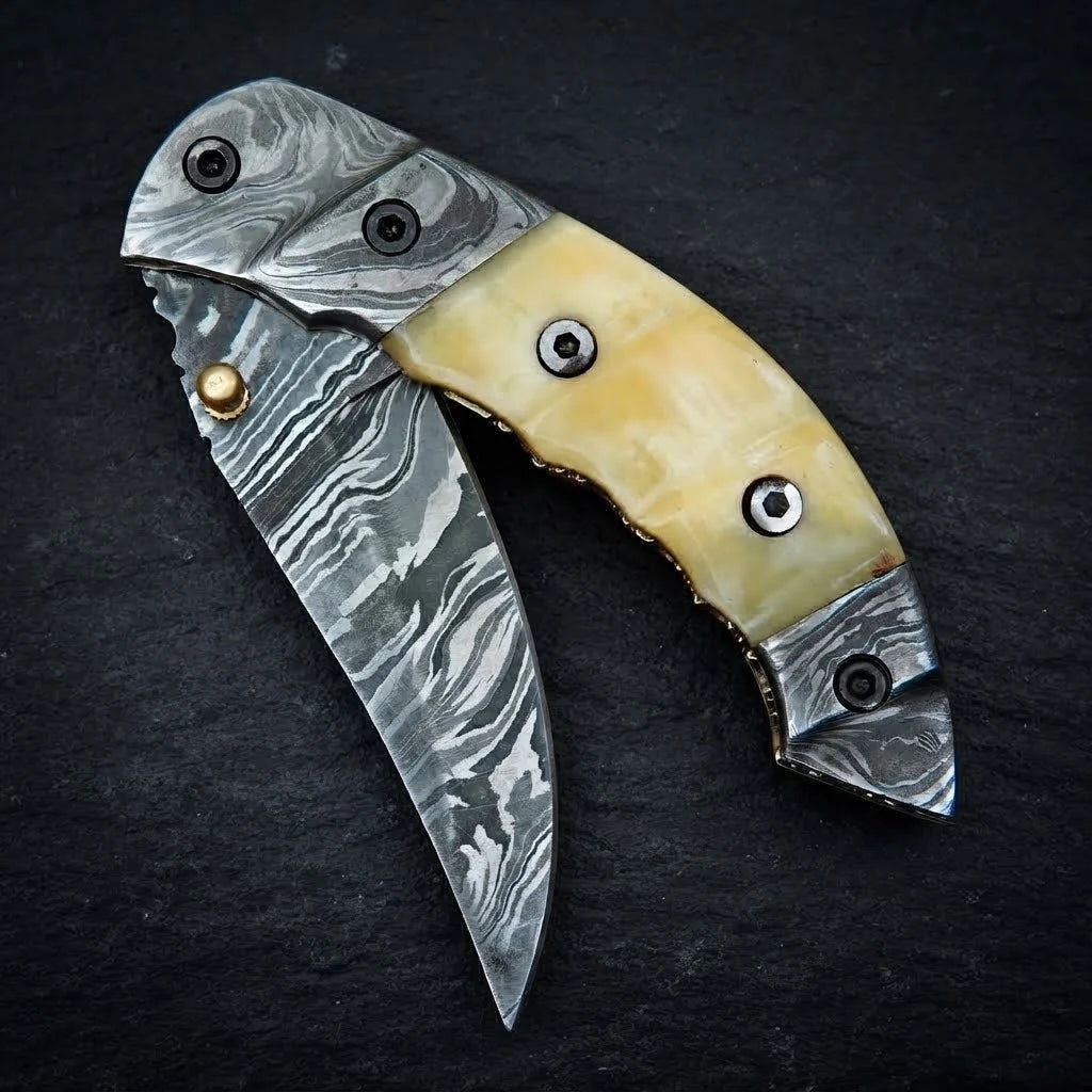 Camel bone handle and Damascus bolster detail
