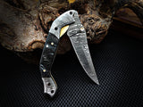 Double Damascus bolster detail on horn handle knife