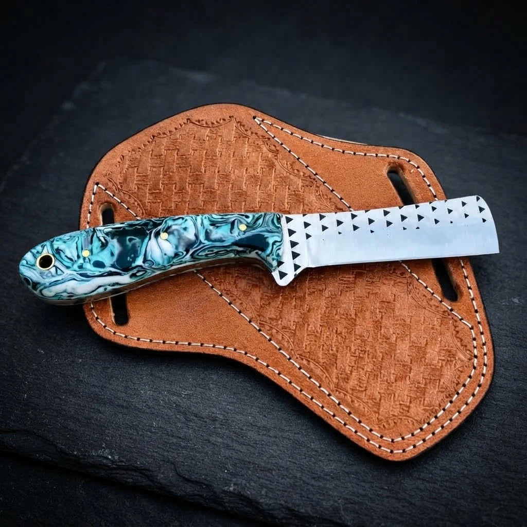 Dustfang bull cutter knife with resin handle and leather sheath, front view