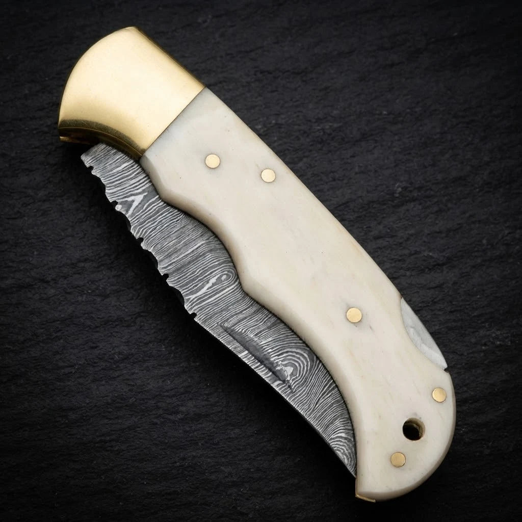 Damascus EDC folding knife with camel bone handle and brass bolster – handle detail