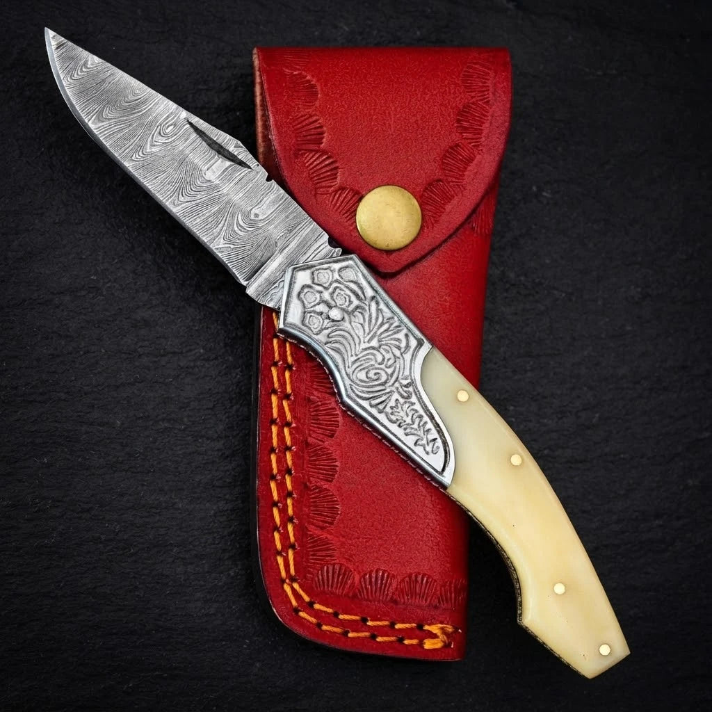 Damascus EDC folding knife with camel bone handle and engraved bolster – full view