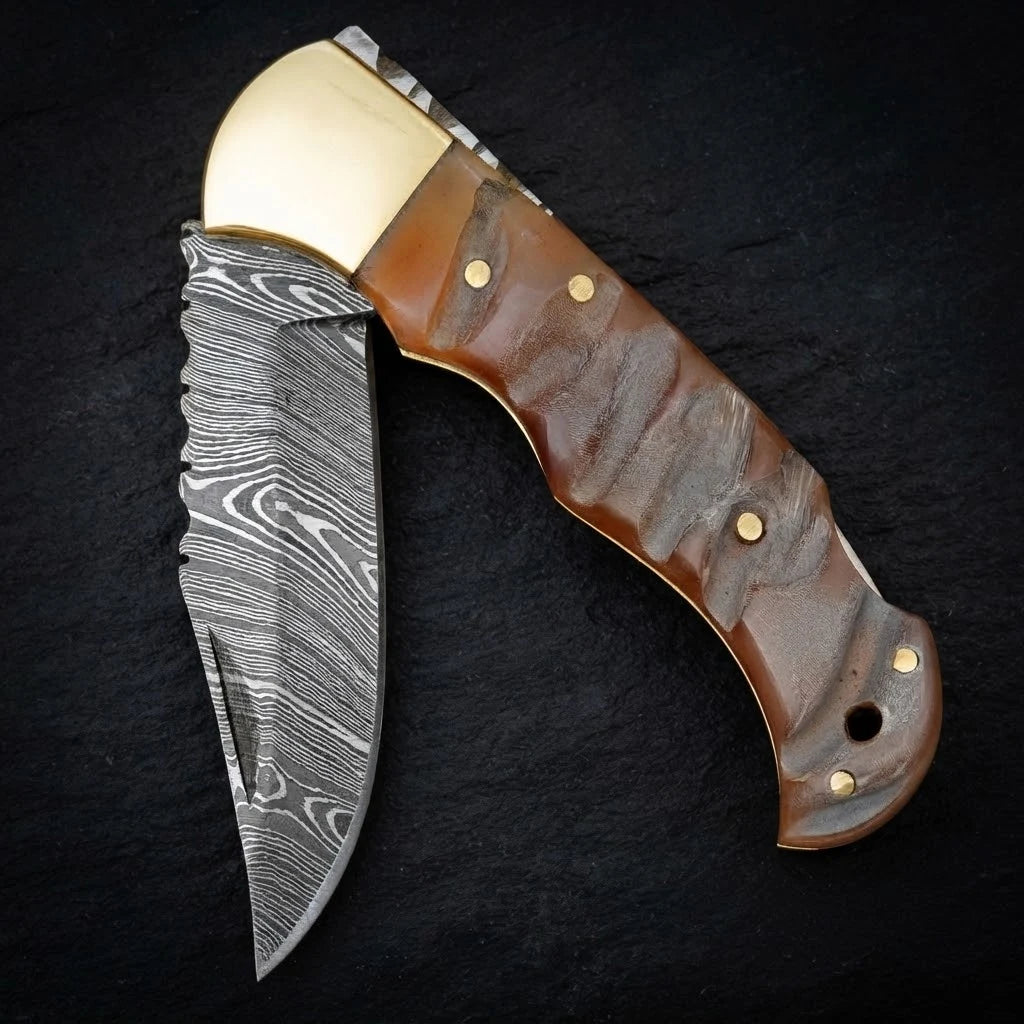 Damascus EDC folding knife with ram horn handle and brass bolster – full view