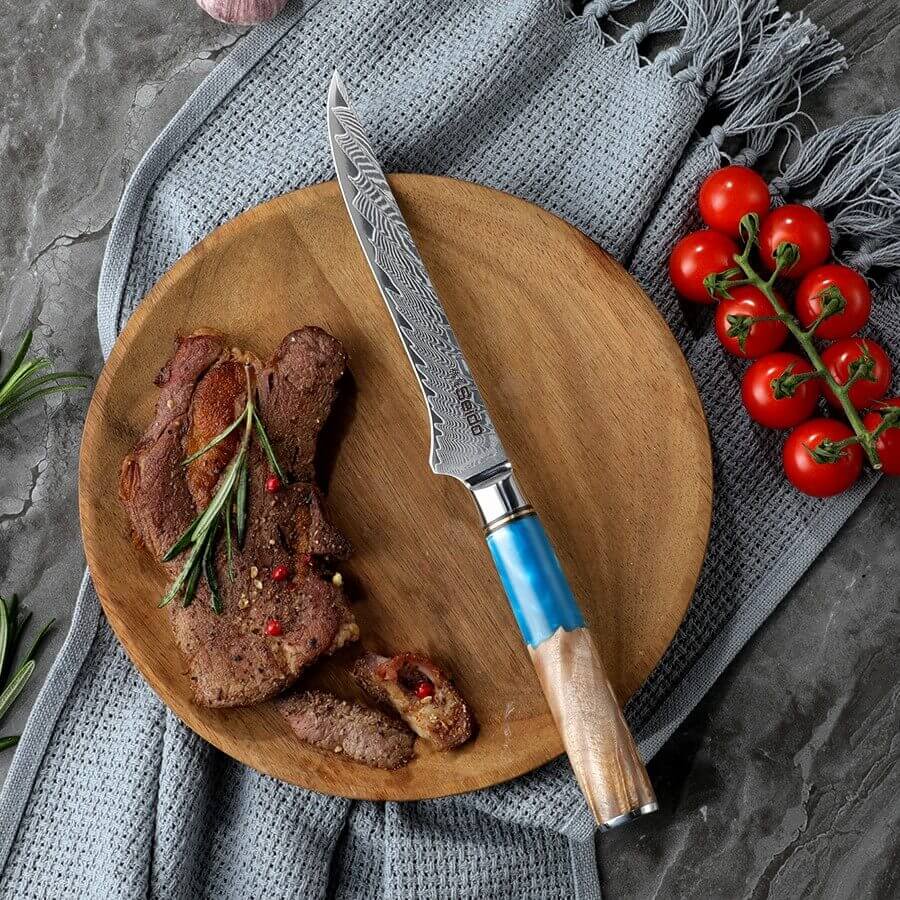 Executive Damascus steel boning knife with blue resin and wood handle