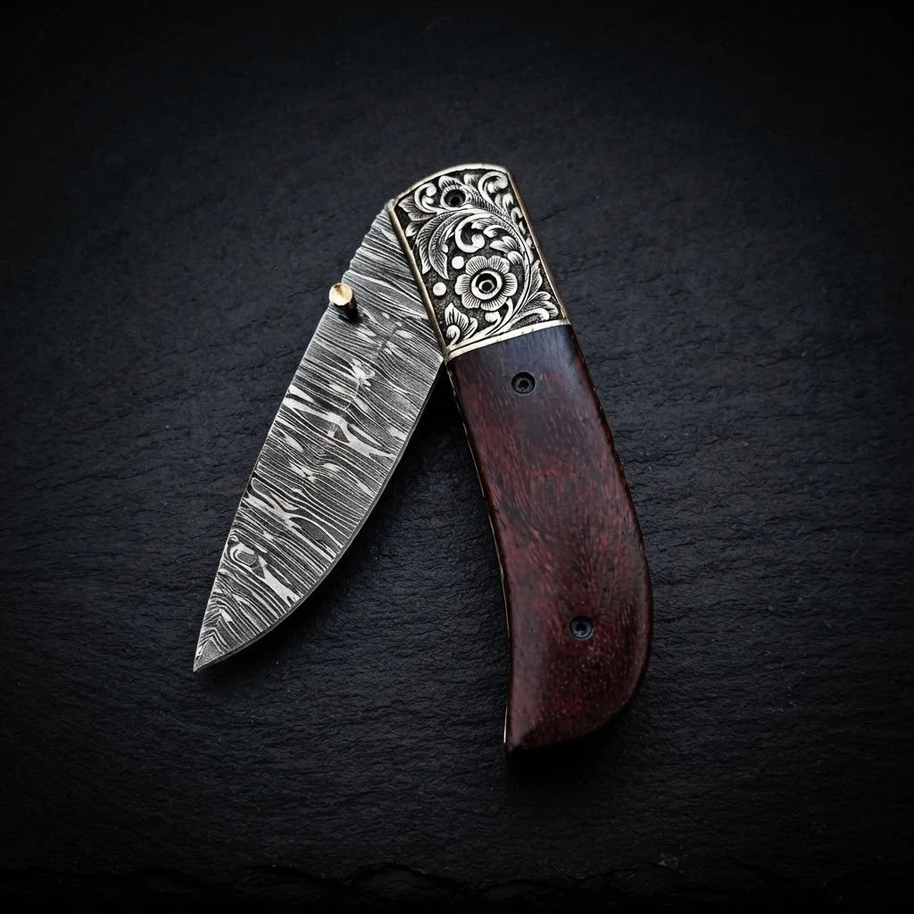 Walnut wood handle folding knife — Damascus steel blade close-up