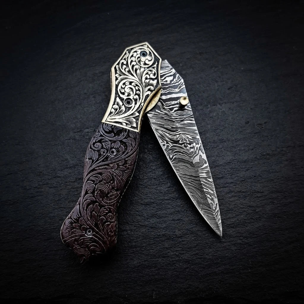 Damascus dagger knife with engraved brass bolster and walnut burl wood handle – blade close-up