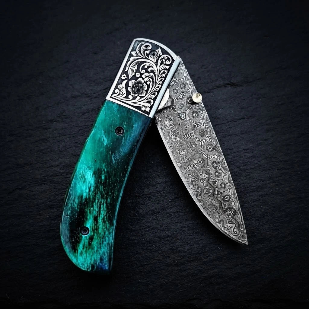 Damascus folding knife with green camel bone handle and steel bolster – handle detail