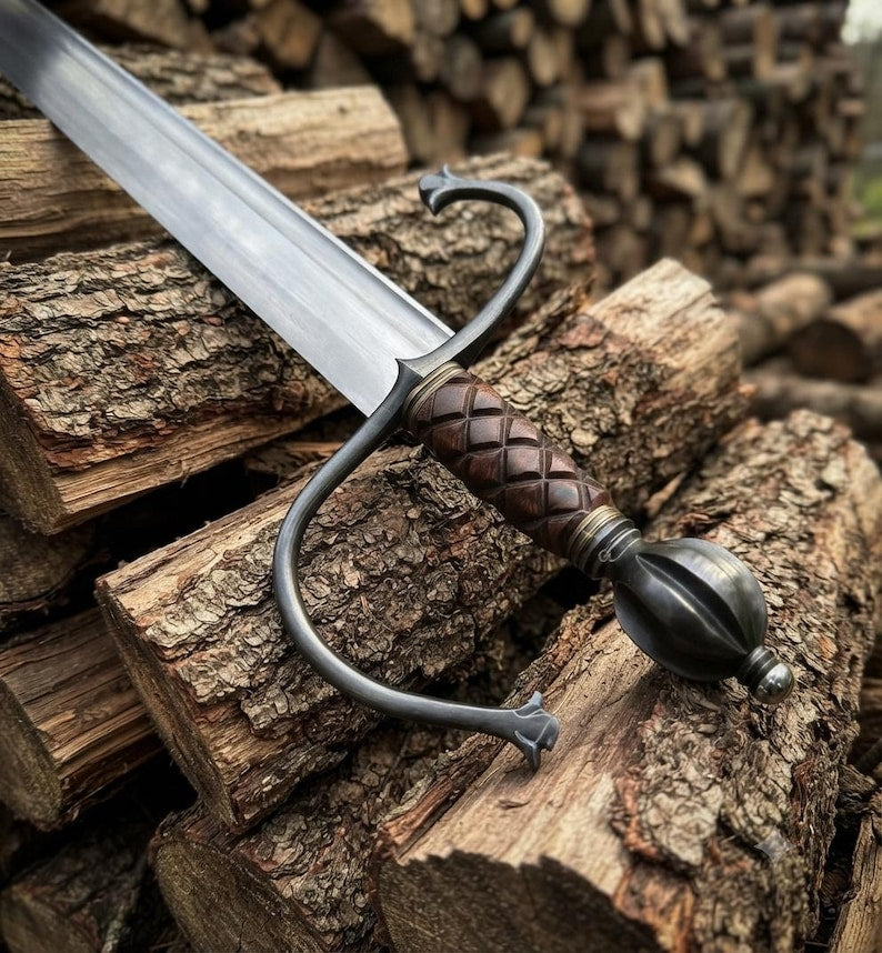 Close-up of the Spada sword's swept steel guard