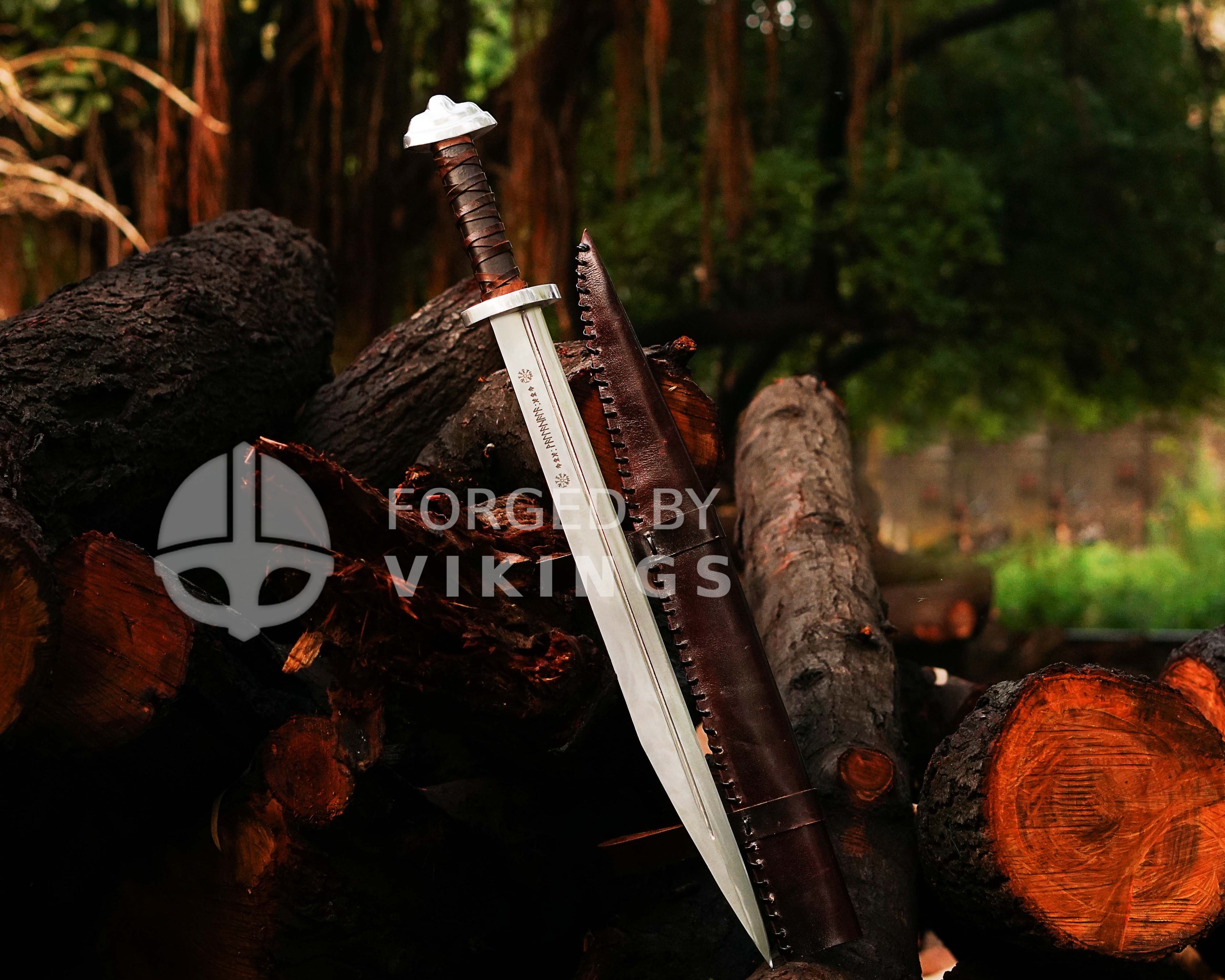 Authentic Viking Seax sword with intricate blade engravings and leather scabbard.
