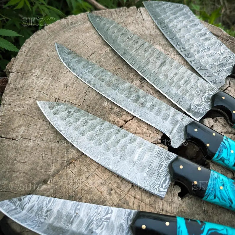 Close-up of teal resin handle with G10 and brass pin detail