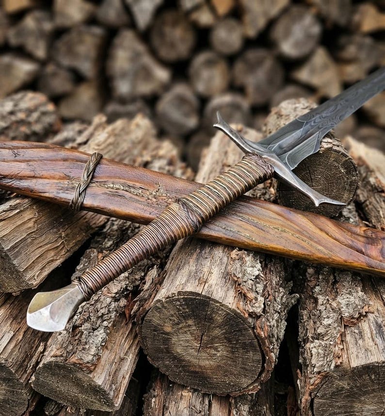Rustic weathered finish detail on the sword prop