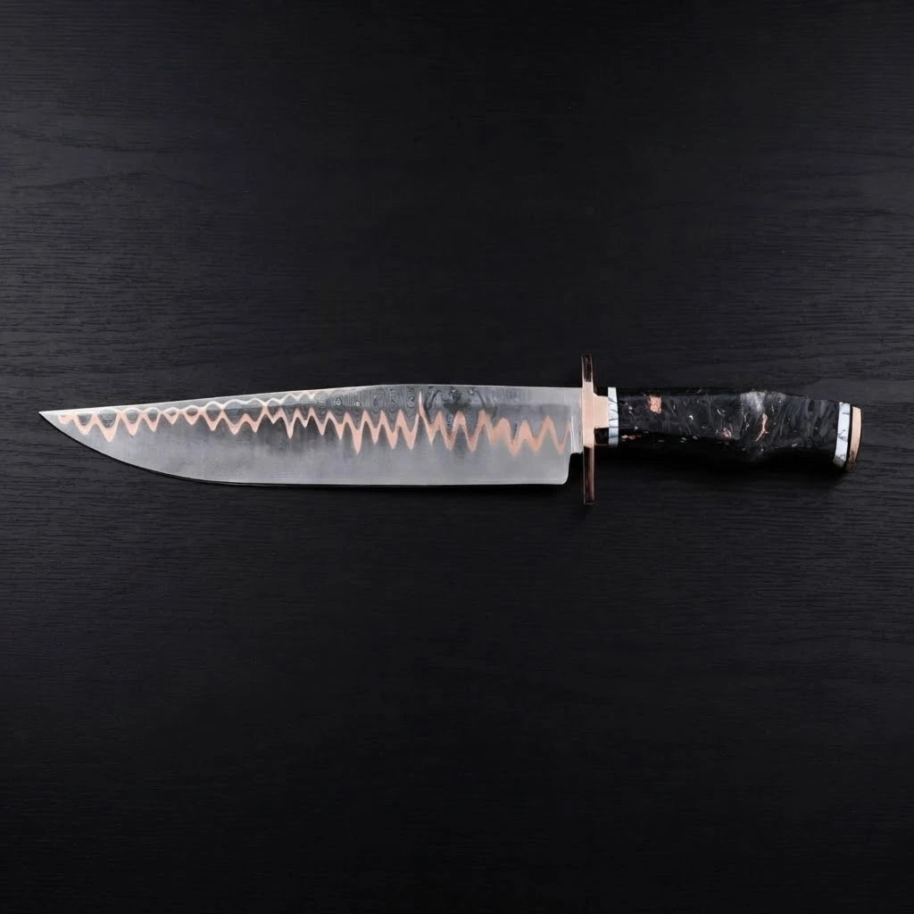 Horizontal view of a handforged 11-inch Copper Damascus Bowie knife featuring a copper guard and a marbled black resin handle on a dark wood background
