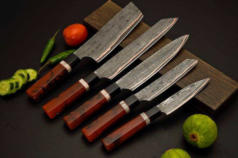 Copper Damascus kitchen knife set showing Cu-Mai copper wave pattern on the blades