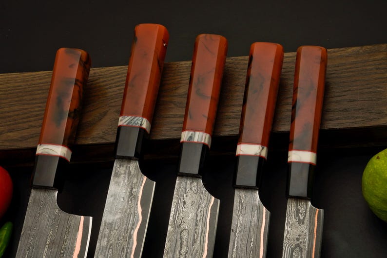 Copper Damascus chef knife set with high carbon steel edges and resin octagon handles