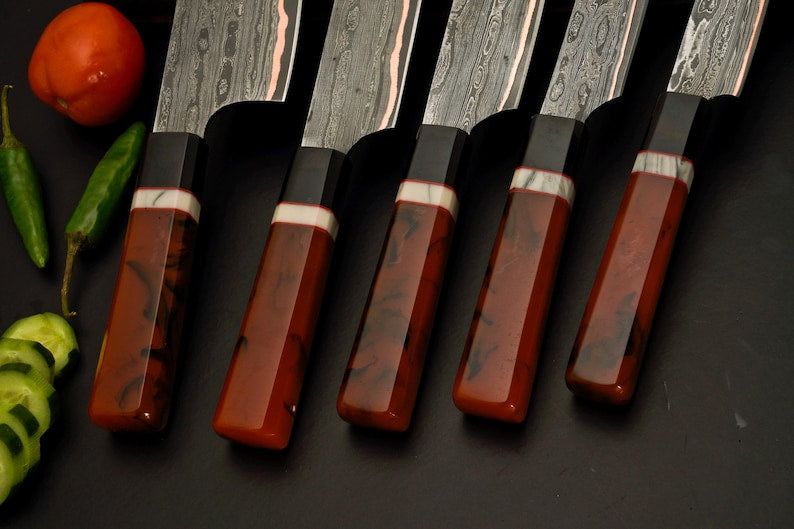 Copper and steel layered Damascus blades from the handmade chef knife set