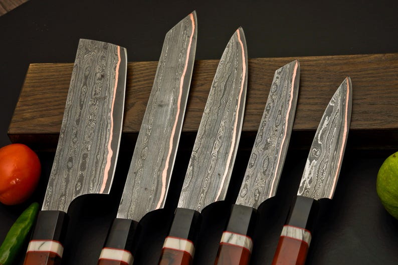 Octagon resin handles on the handmade copper Damascus kitchen knives