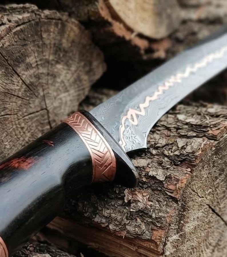 Guard and copper accent detail on the Elven sword