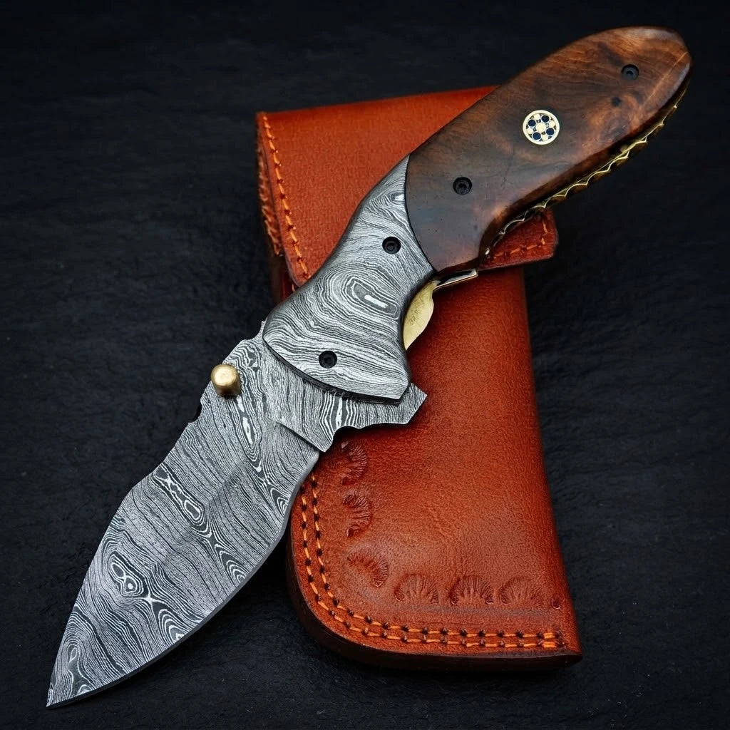 Handmade Damascus folding knife with rosewood handle and Damascus bolster – folded with sheath