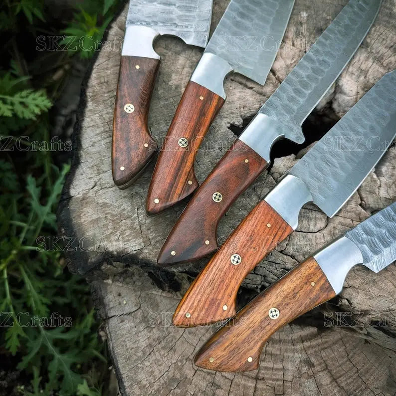 Close-up of Damascus steel blade pattern on rosewood handle knife