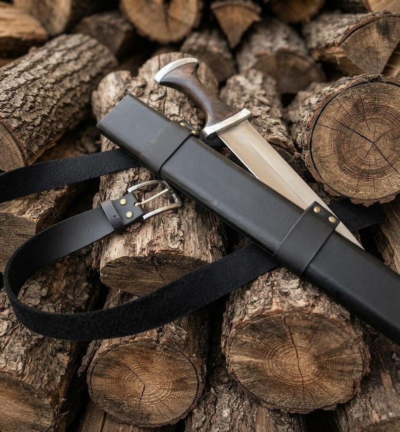 Short sword resting in its leather scabbard