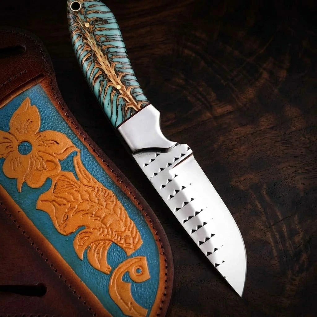 A full horizontal profile view of a handmade USA cowboy knife forged from a steel rasp file, featuring a unique turquoise-dyed pine cone hybrid resin handle and a polished bolster, lying flat on a dark wood grain background.