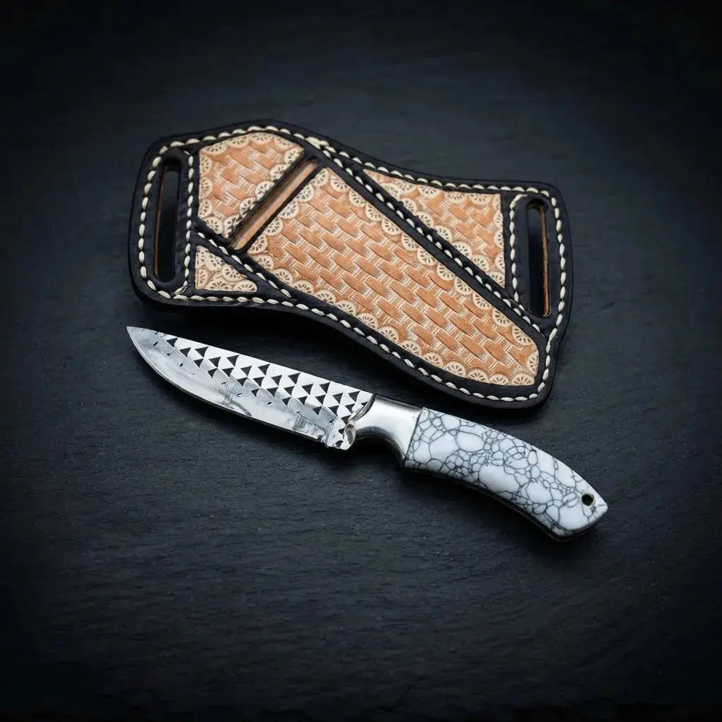 Hand-stitched cross-draw leather sheath with decorative artwork for stone handle skinner knife