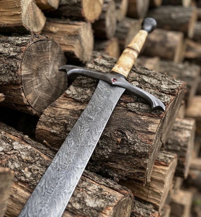 Damascus longsword displayed on wood