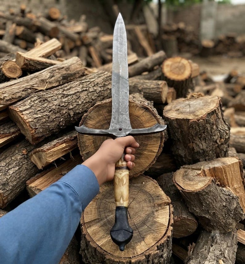Damascus longsword resting in its leather sheath