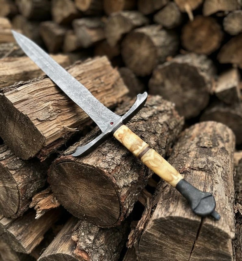 Engraved bone handle detail on the Damascus longsword